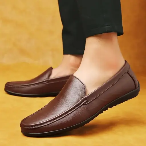 Step into comfort and style with these Spring genuine leather men’s loafers. Handmade with a soft sole, these moccasins offer a minimalist design ideal for business or casual wear | US $23.95